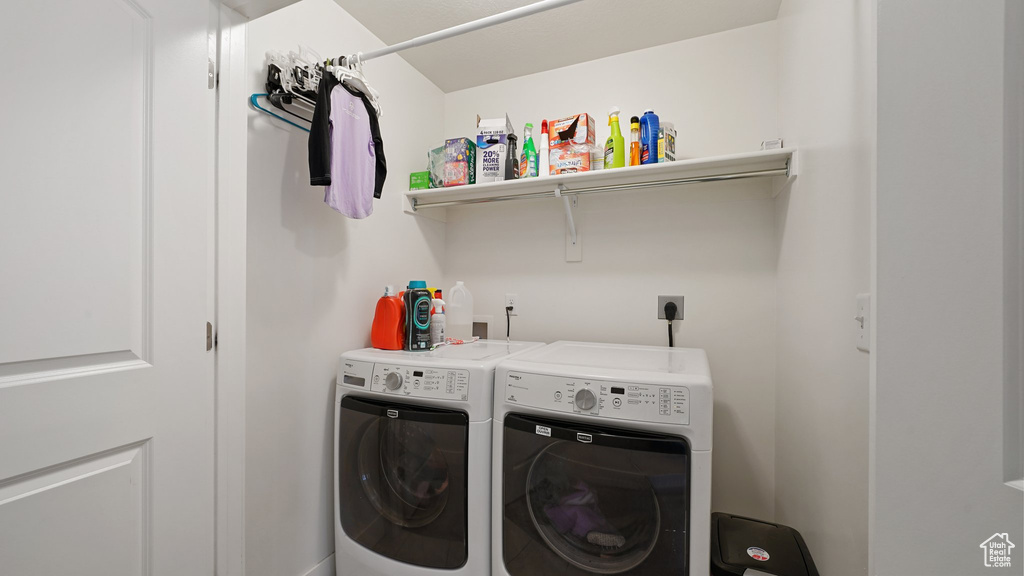 Laundry area featuring laundry area and washing machine and dryer