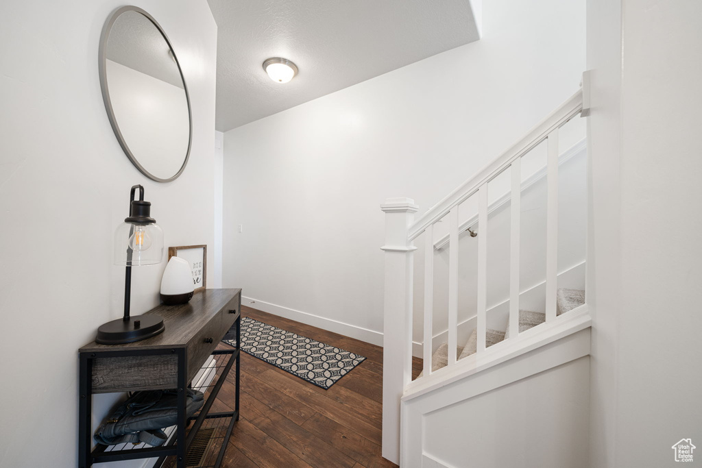 Interior space featuring wood-type flooring and baseboards