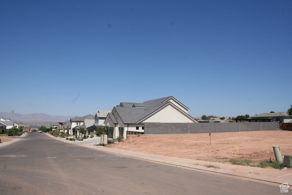 View of street with a residential view and curbs