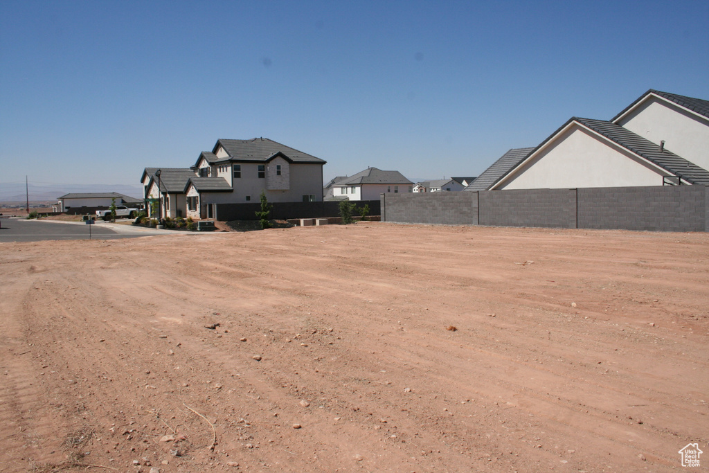 View of yard with fence and a residential view