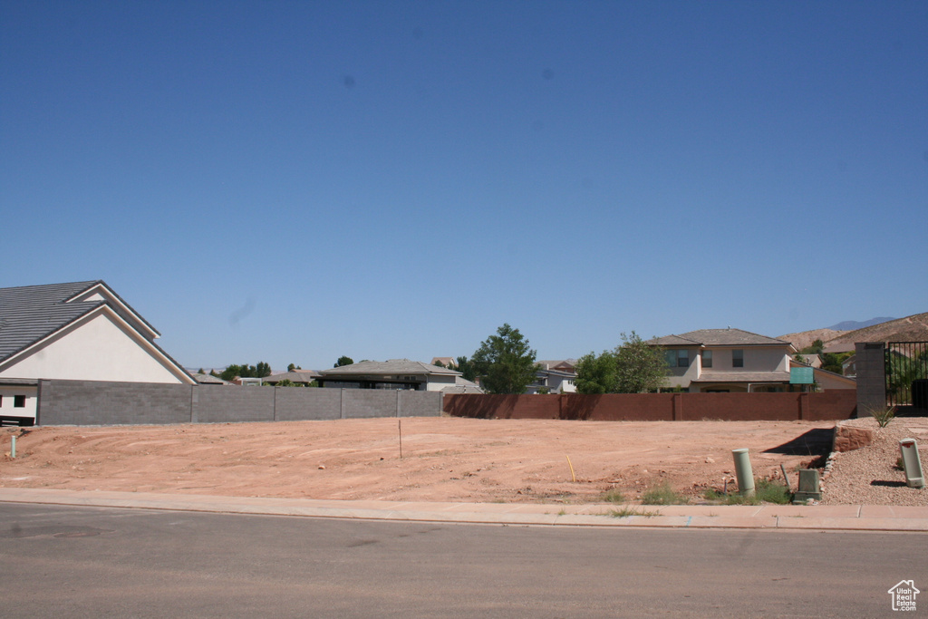 View of yard featuring fence