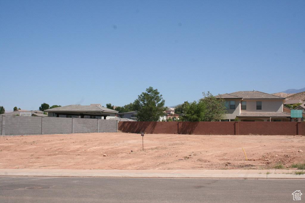 View of yard featuring fence