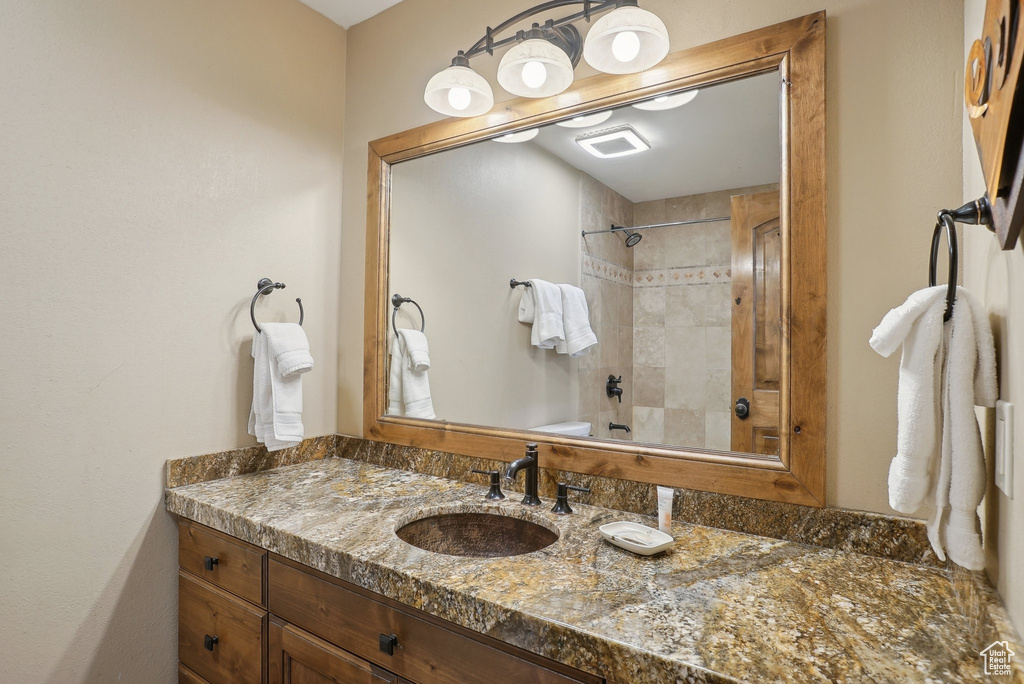 Full bath featuring shower / bathtub combination and vanity