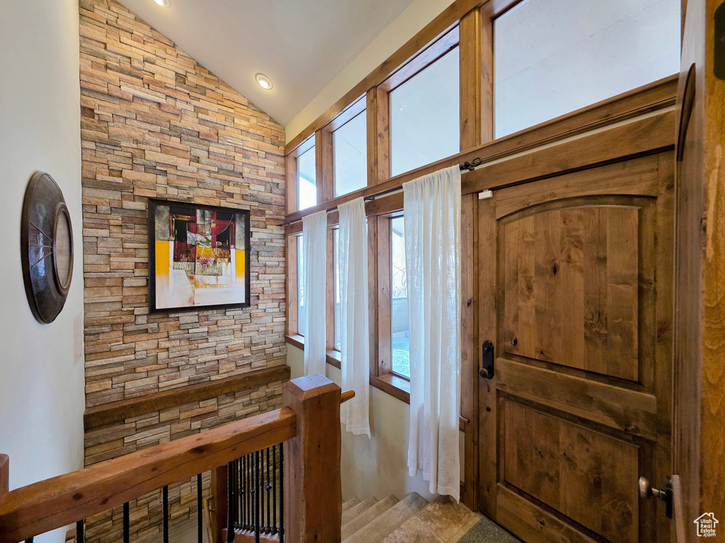 Entrance foyer featuring vaulted ceiling