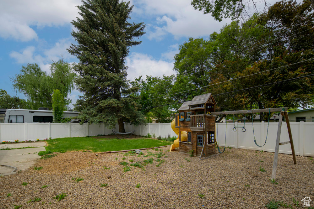 View of yard featuring a playground