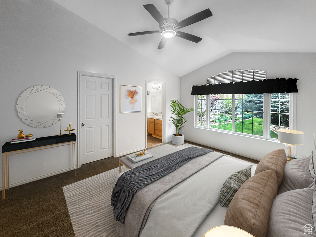 Carpeted bedroom with a sink, ceiling fan, ensuite bath, and lofted ceiling
