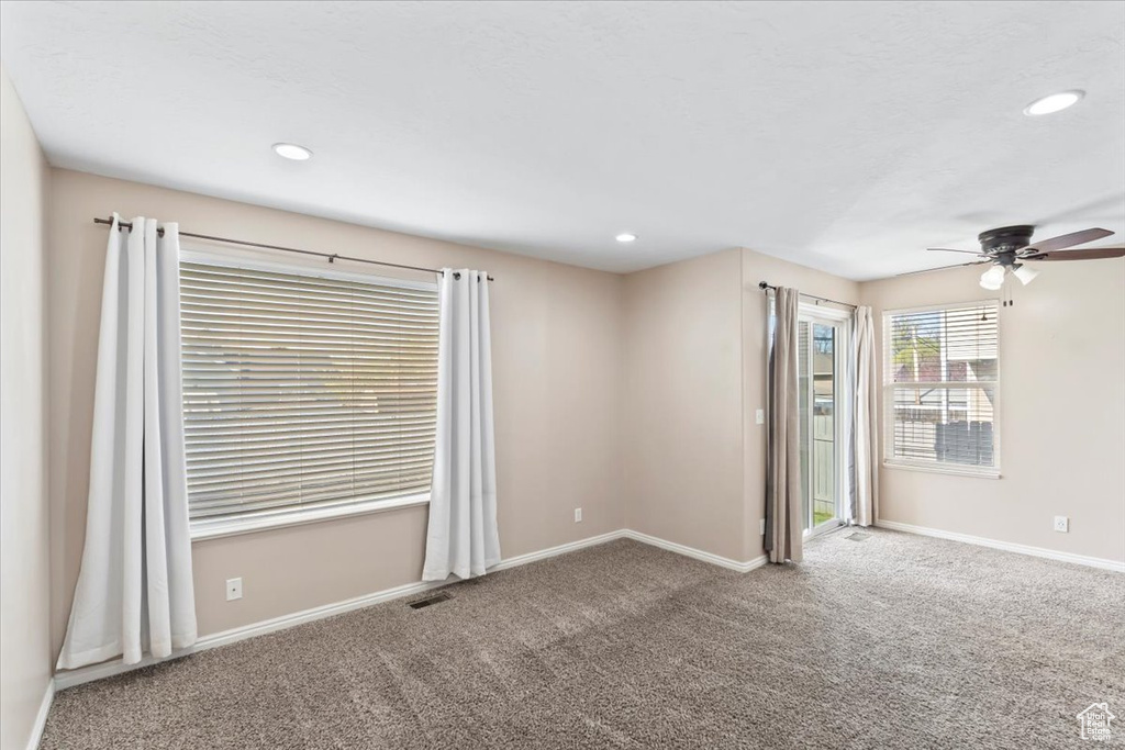 Unfurnished room with visible vents, baseboards, a ceiling fan, carpet, and recessed lighting