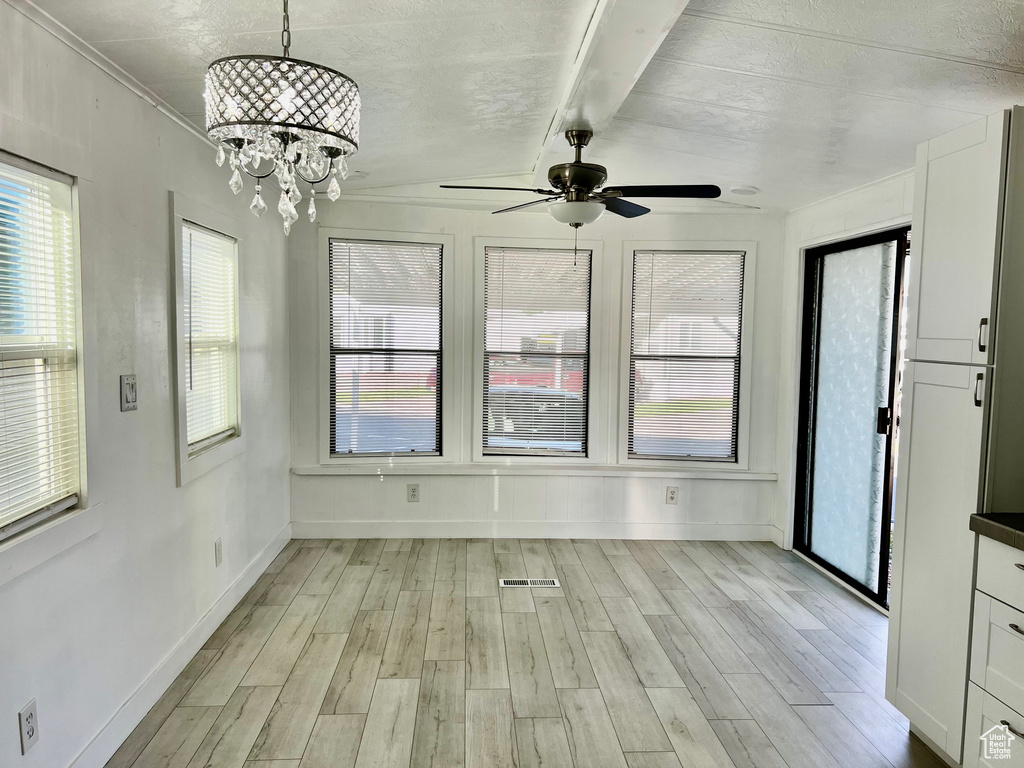Interior space featuring visible vents and an inviting chandelier