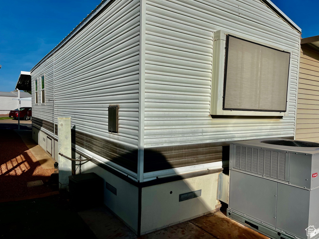 View of property exterior featuring central AC unit