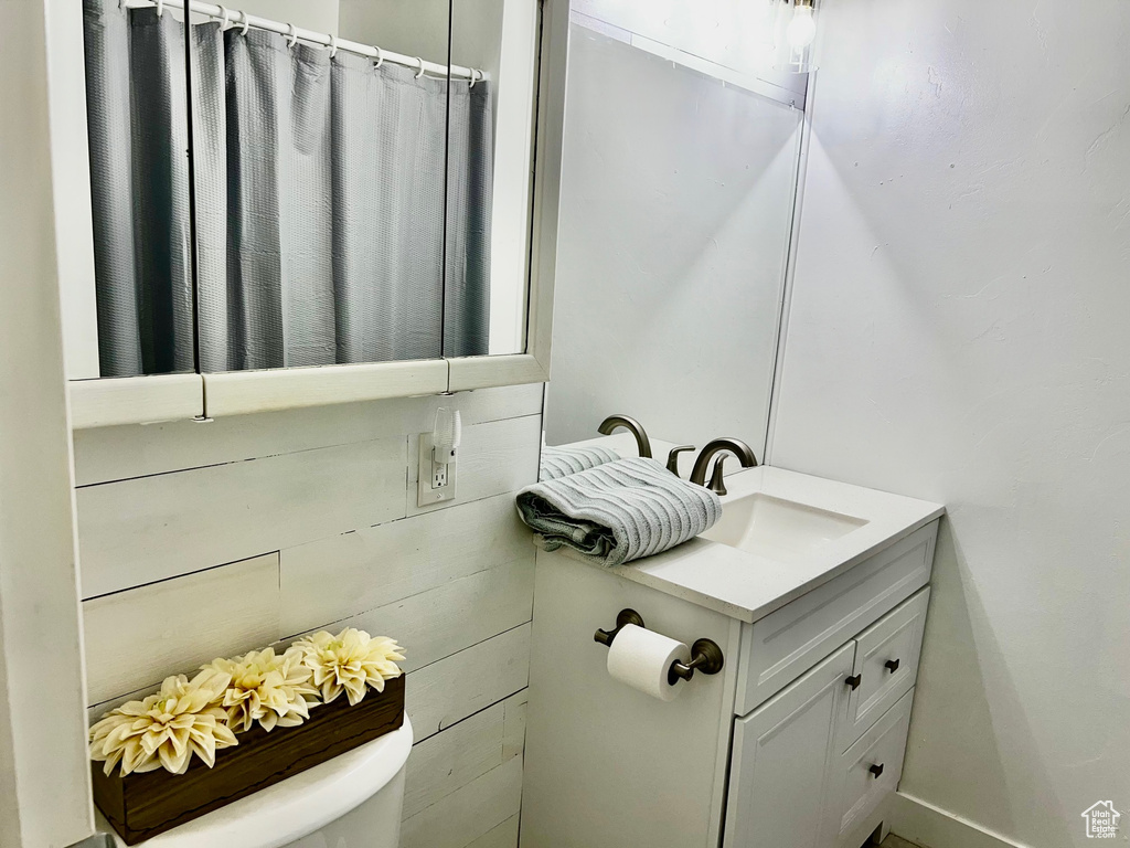 Bathroom featuring vanity and toilet