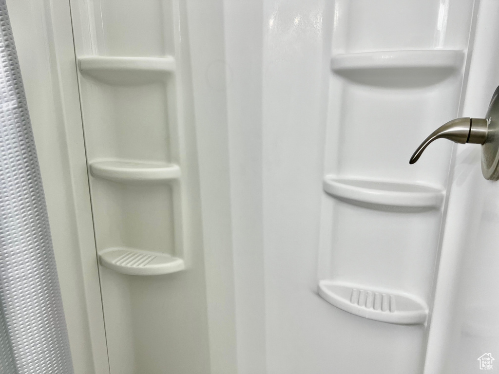 Room details featuring a stall shower