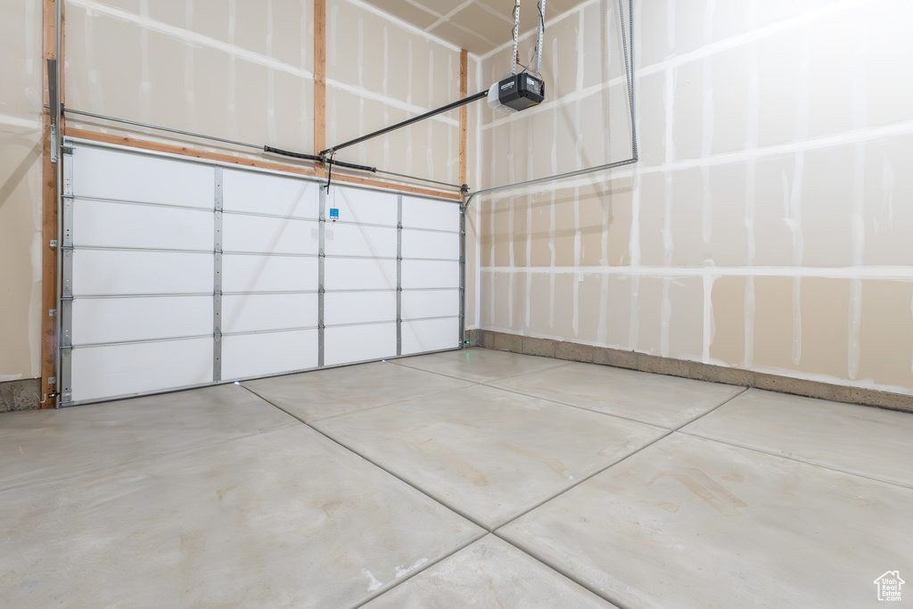 Garage featuring a garage door opener
