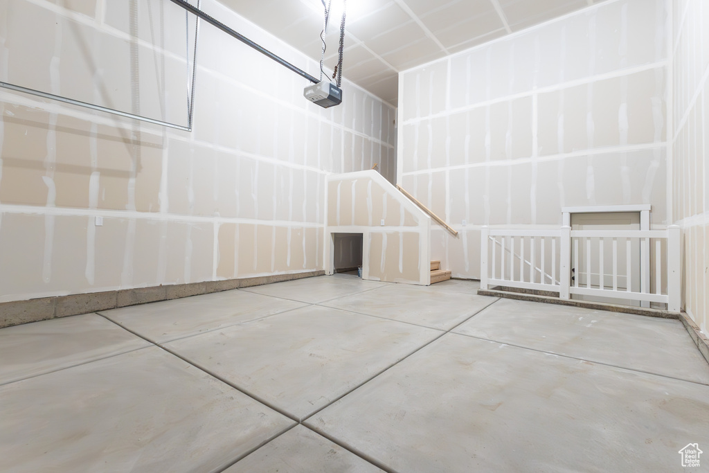 Garage featuring a garage door opener