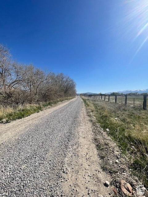 View of dirt / gravel road featuring a view of countryside