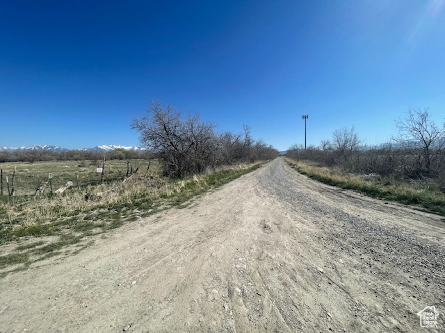 View of dirt / gravel road featuring a view of countryside