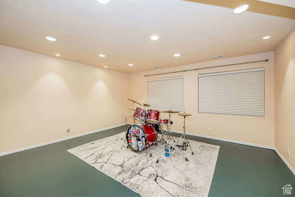 Game room with concrete flooring and recessed lighting