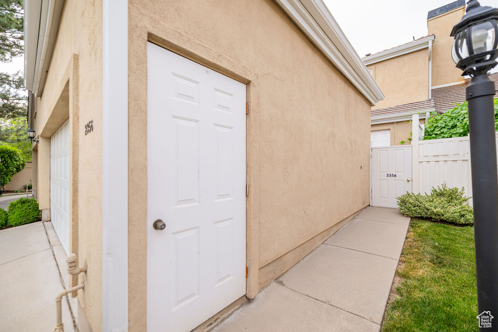 View of exterior entry with stucco siding