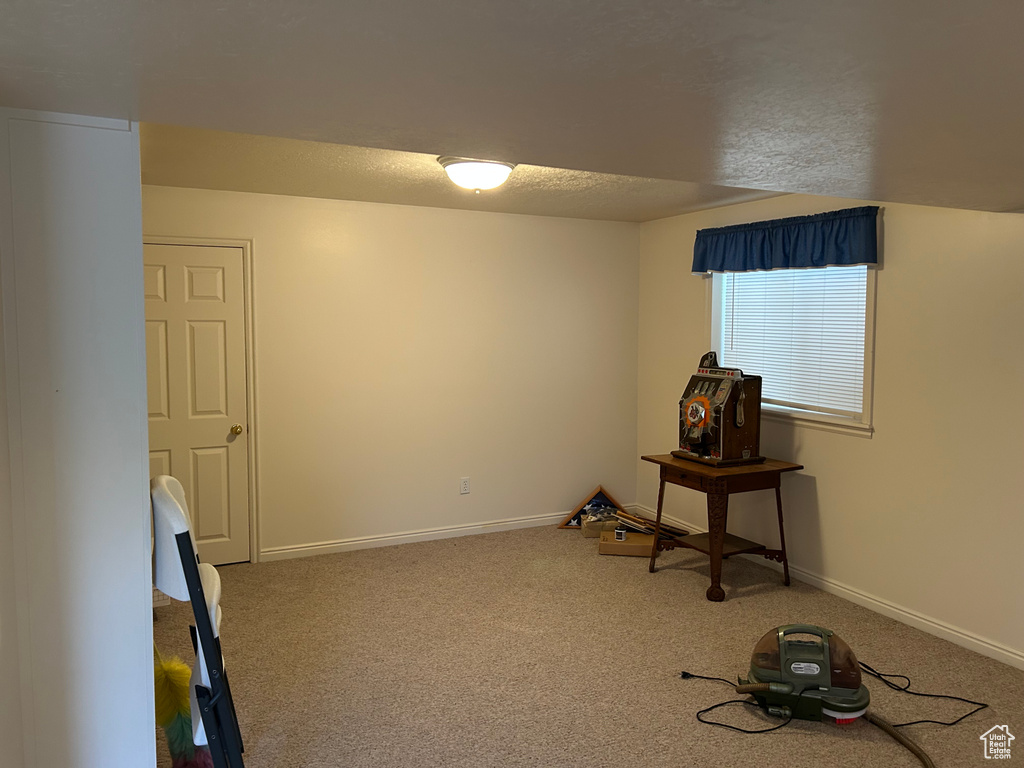 Interior space with baseboards and a textured ceiling