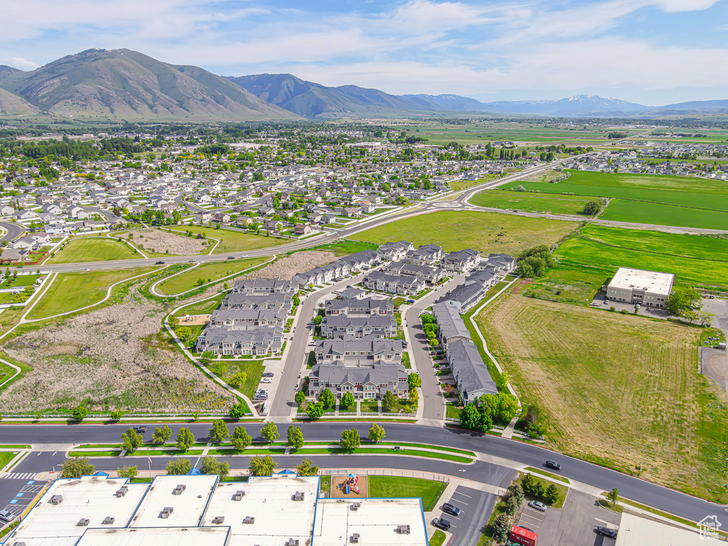 Aerial perspective of suburban area featuring a mountainous background