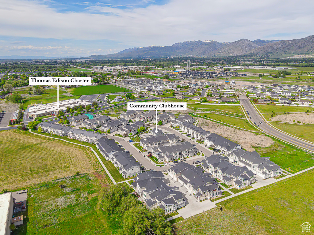 View of property location featuring a mountain backdrop and nearby suburban area
