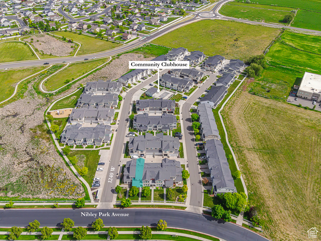 Aerial view of property's location featuring nearby suburban area