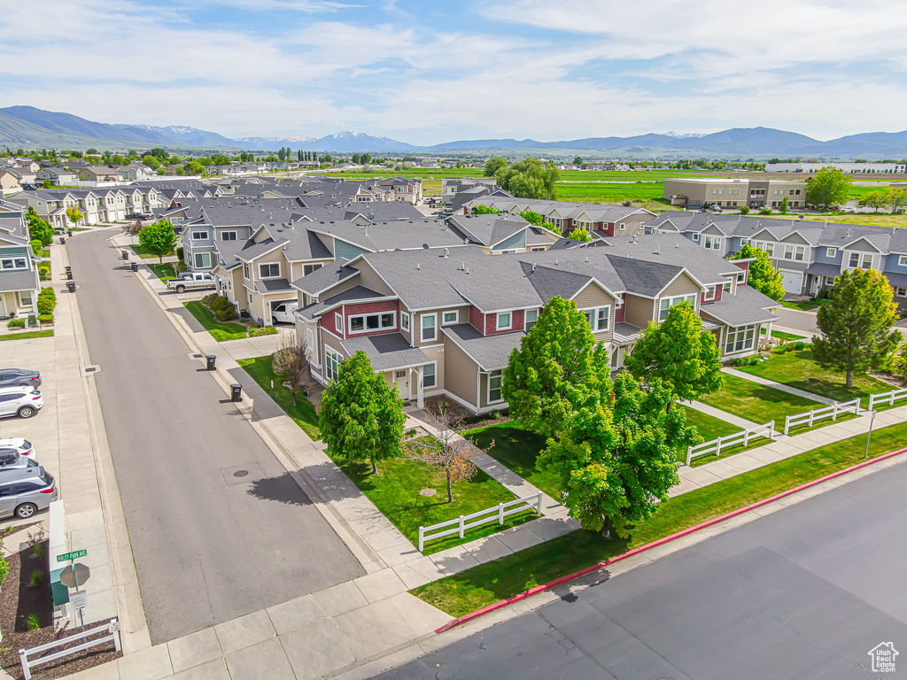 Aerial view of residential area featuring a mountain backdrop