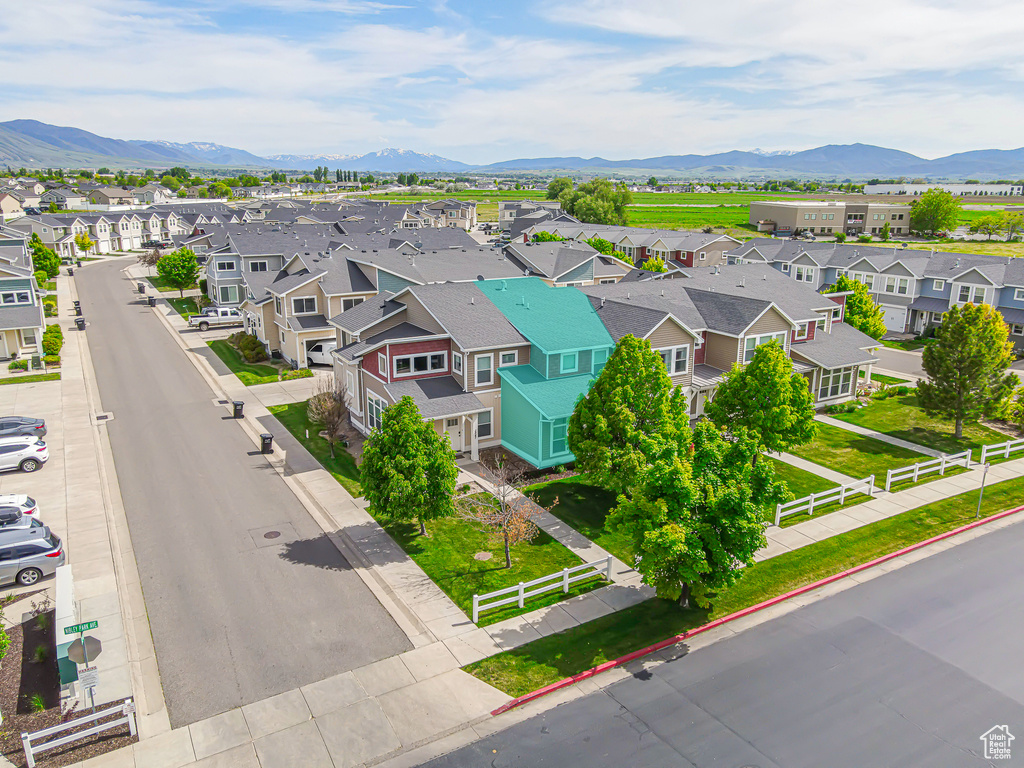 Aerial perspective of suburban area with a mountainous background