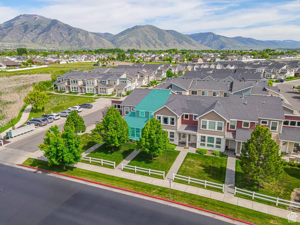 Aerial view of residential area featuring a mountain backdrop