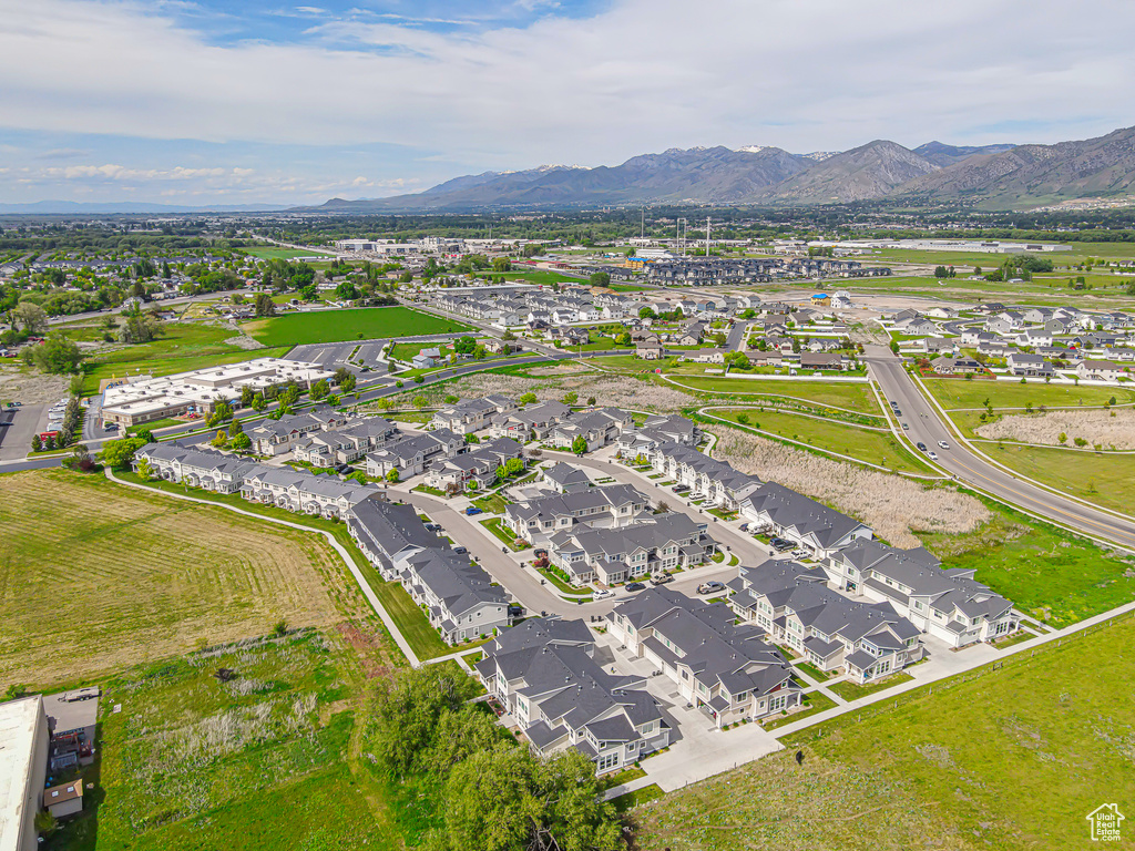 Aerial view of residential area featuring a mountain backdrop