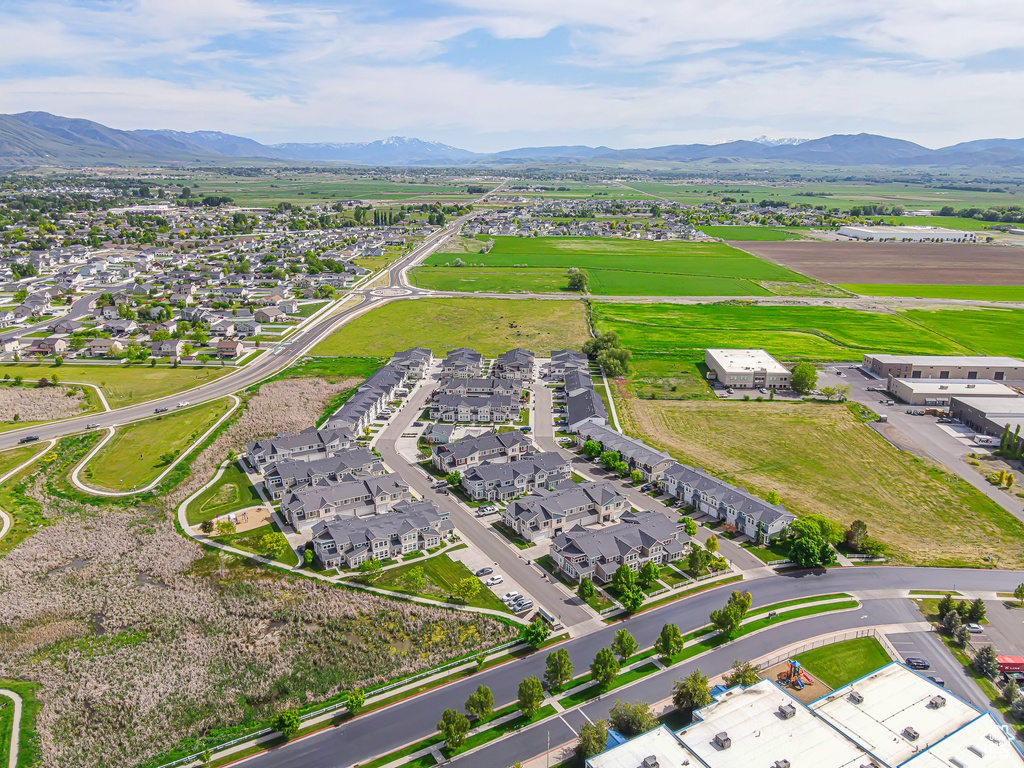 Aerial perspective of suburban area featuring a mountainous background