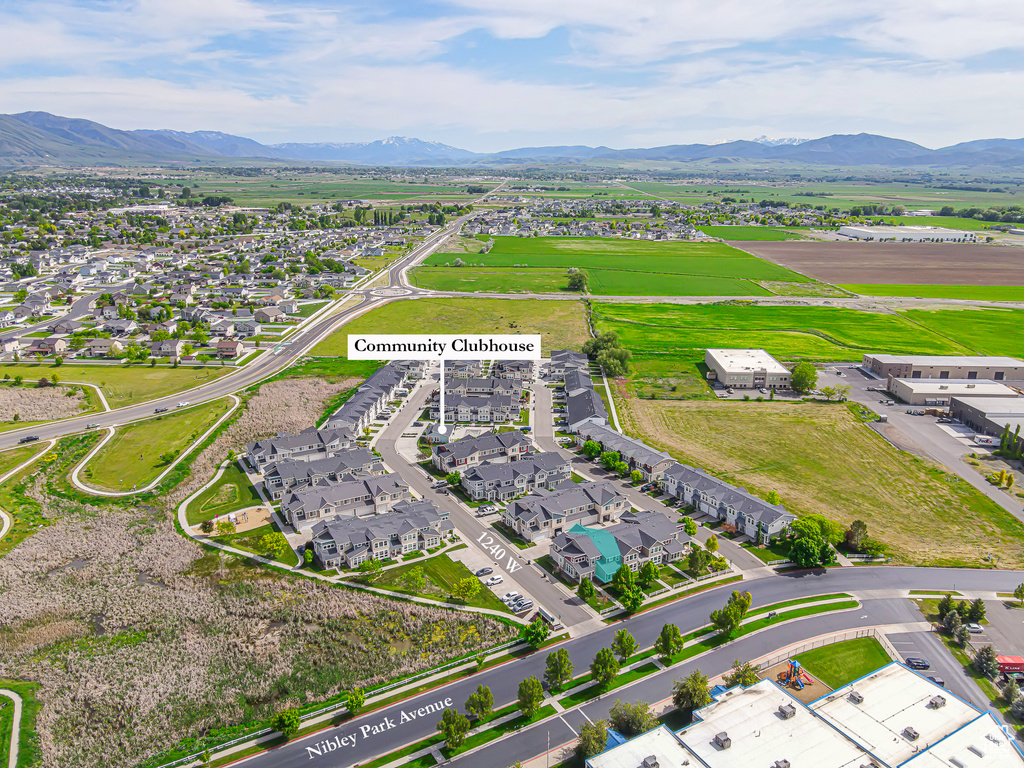 Aerial view of residential area featuring mountains