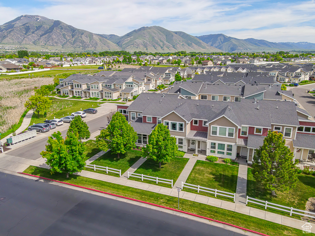 Aerial view of residential area featuring a mountain backdrop