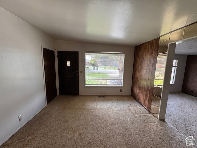 Carpeted empty room with plenty of natural light