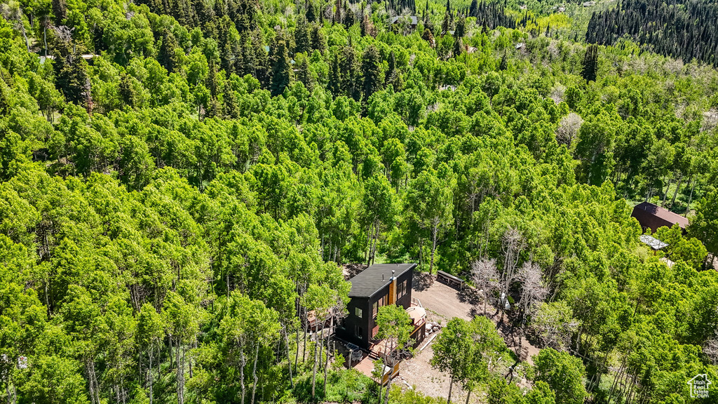 View from above of property with a heavily wooded area