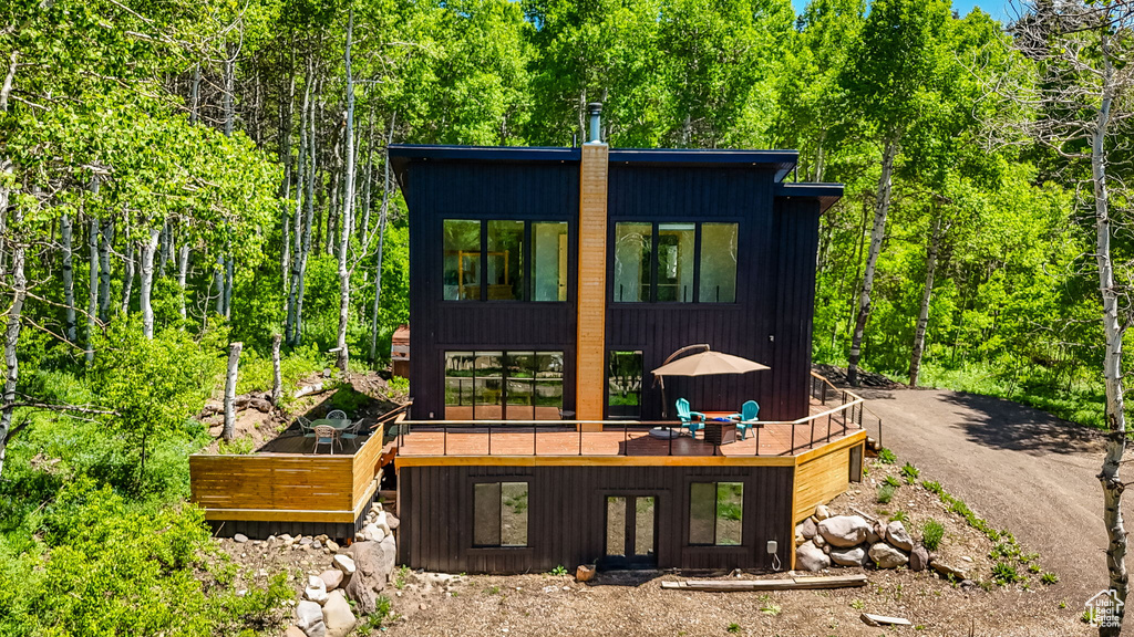 View of front of property featuring a deck and french doors