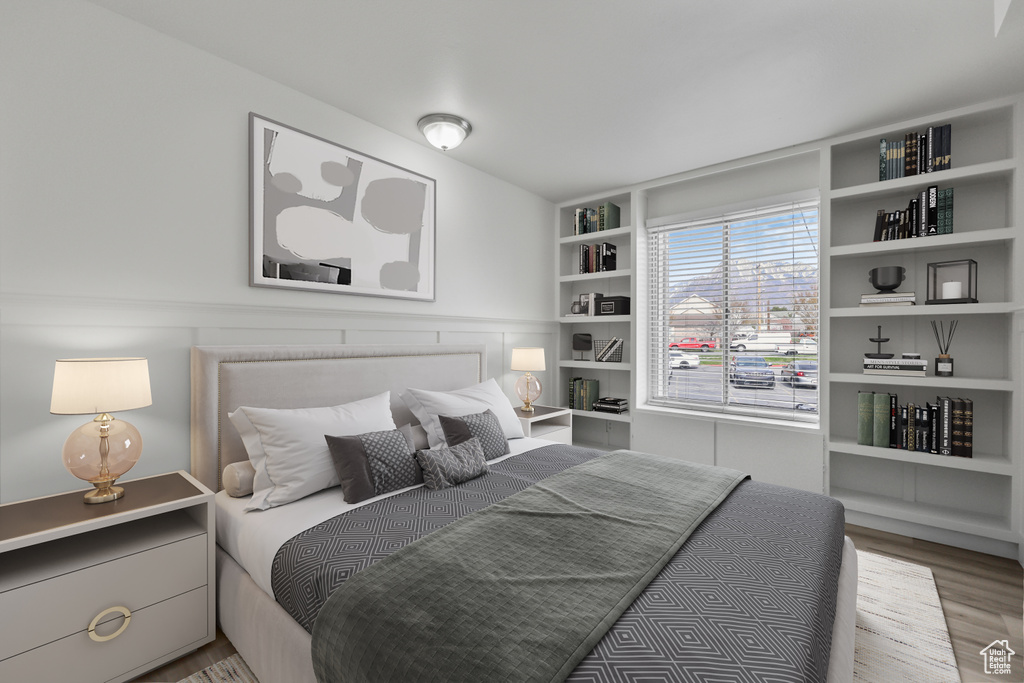 Bedroom with wood finished floors