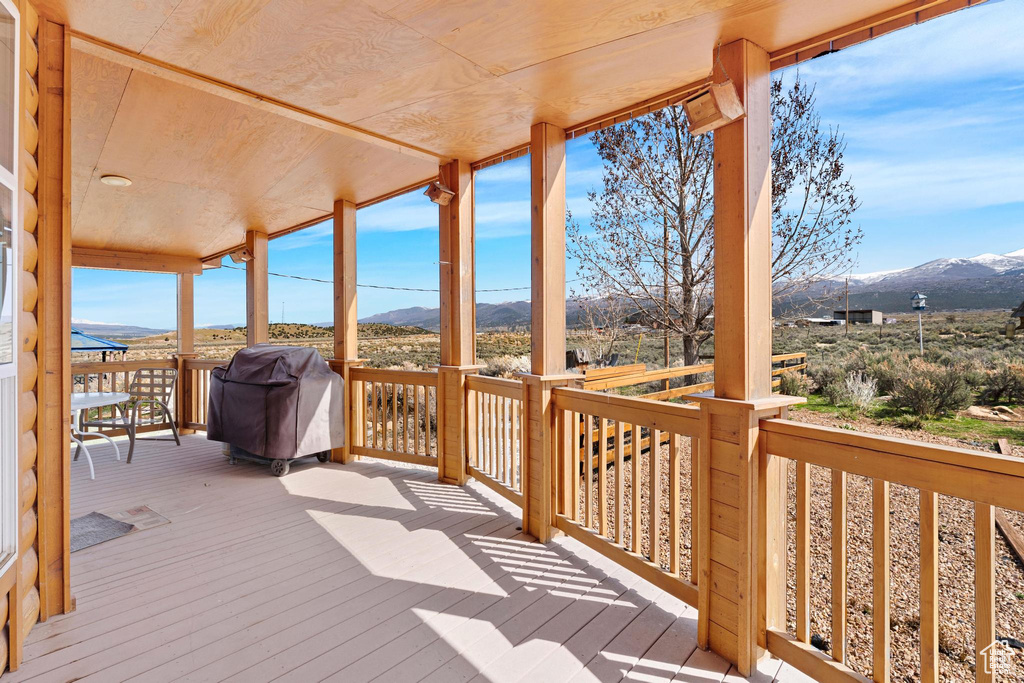 Deck with area for grilling and a mountain view