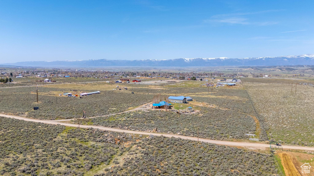 Aerial view featuring a rural view and a mountain view