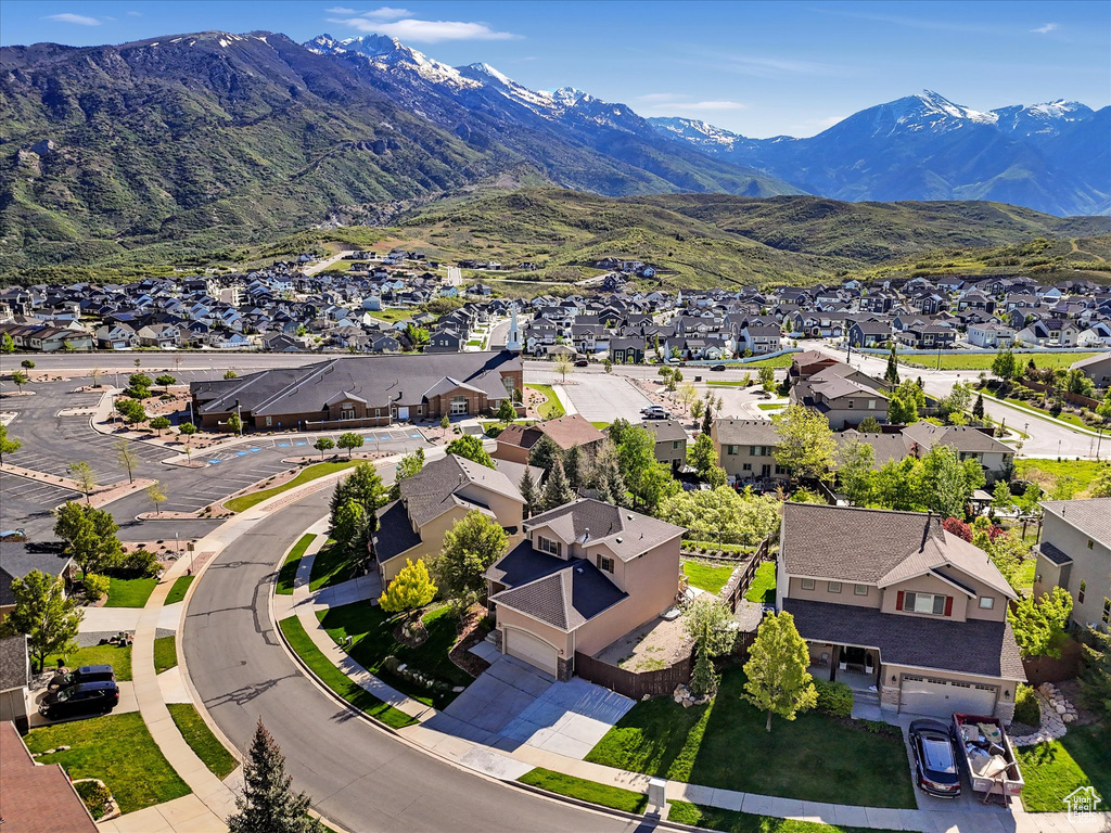 Aerial view of residential area featuring mountains