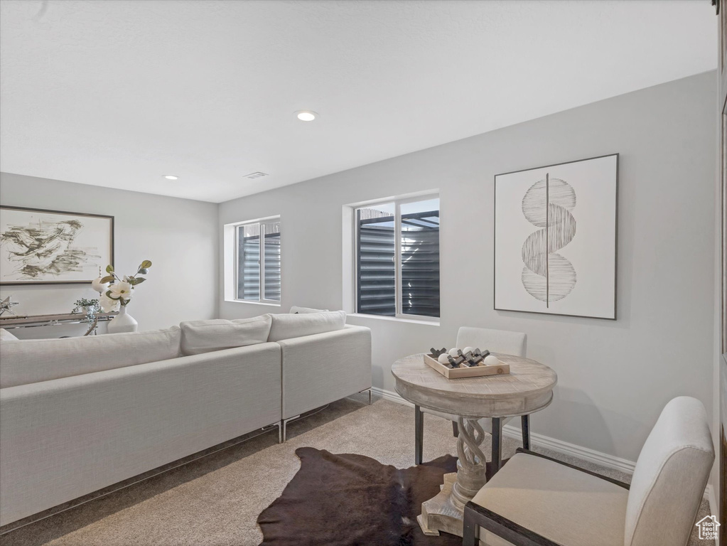 Living room with recessed lighting, carpet, and baseboards