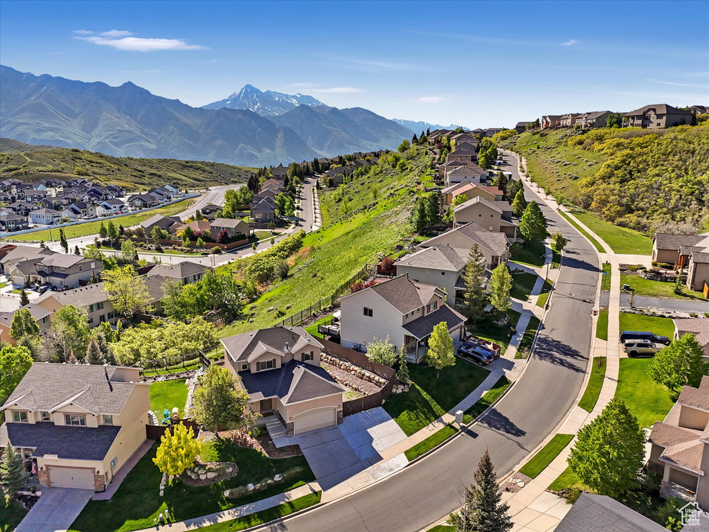 Aerial perspective of suburban area with a mountain backdrop