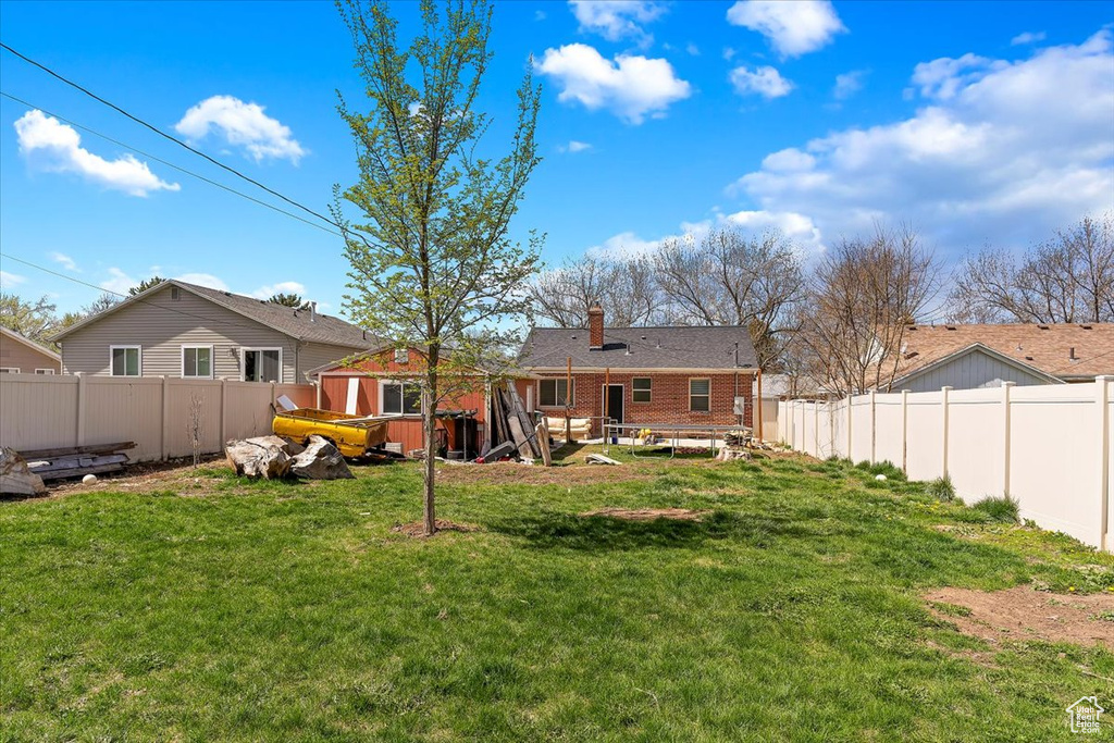 View of yard with a fenced backyard