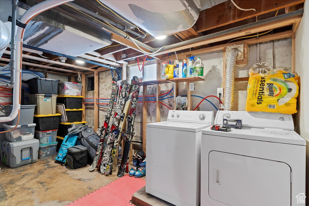Laundry room featuring laundry area and washing machine and clothes dryer
