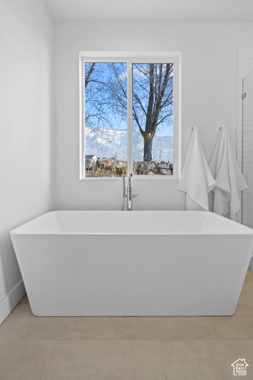 Full bathroom featuring a soaking tub