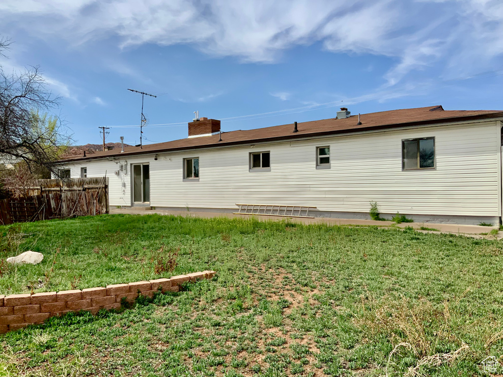Back of property featuring a chimney