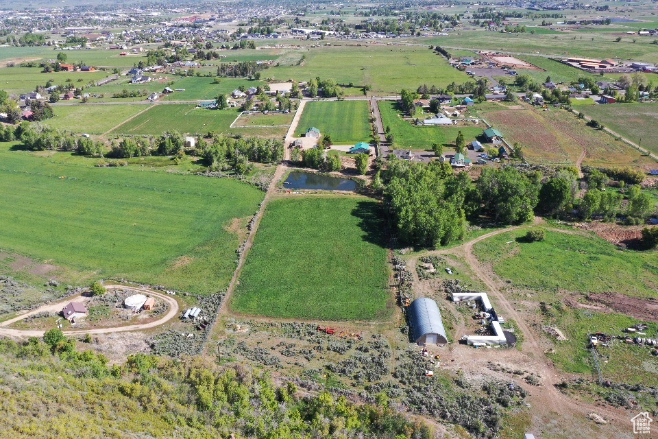 Aerial view of property and surrounding area featuring rural landscape
