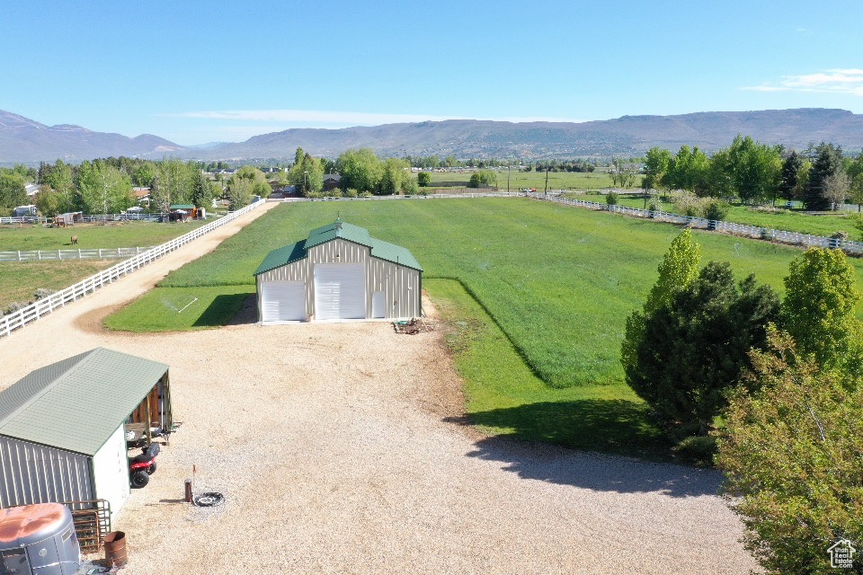 Overview of rural landscape with a mountain backdrop