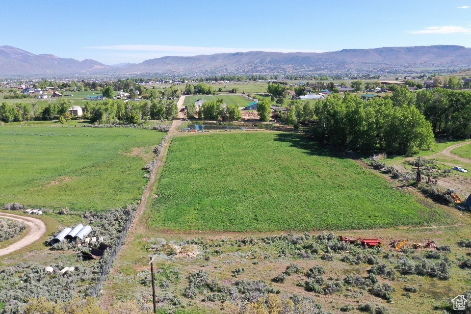 Aerial overview of property\'s location featuring mountains and rural landscape