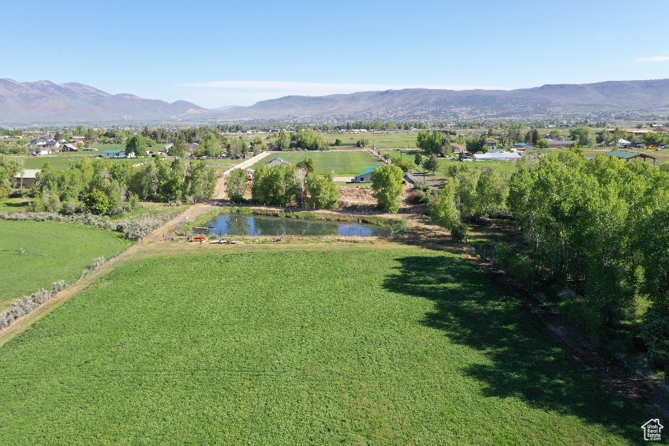 Aerial view of property\'s location featuring a water and mountain view