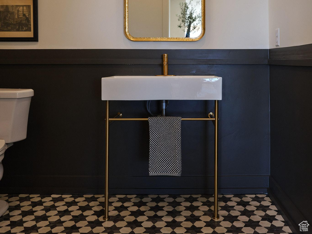 Interior details featuring toilet and a sink